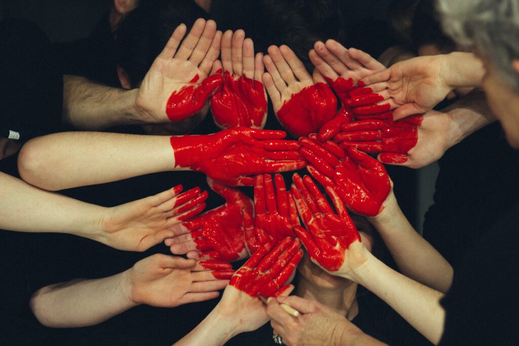 Painted hands forming a heart