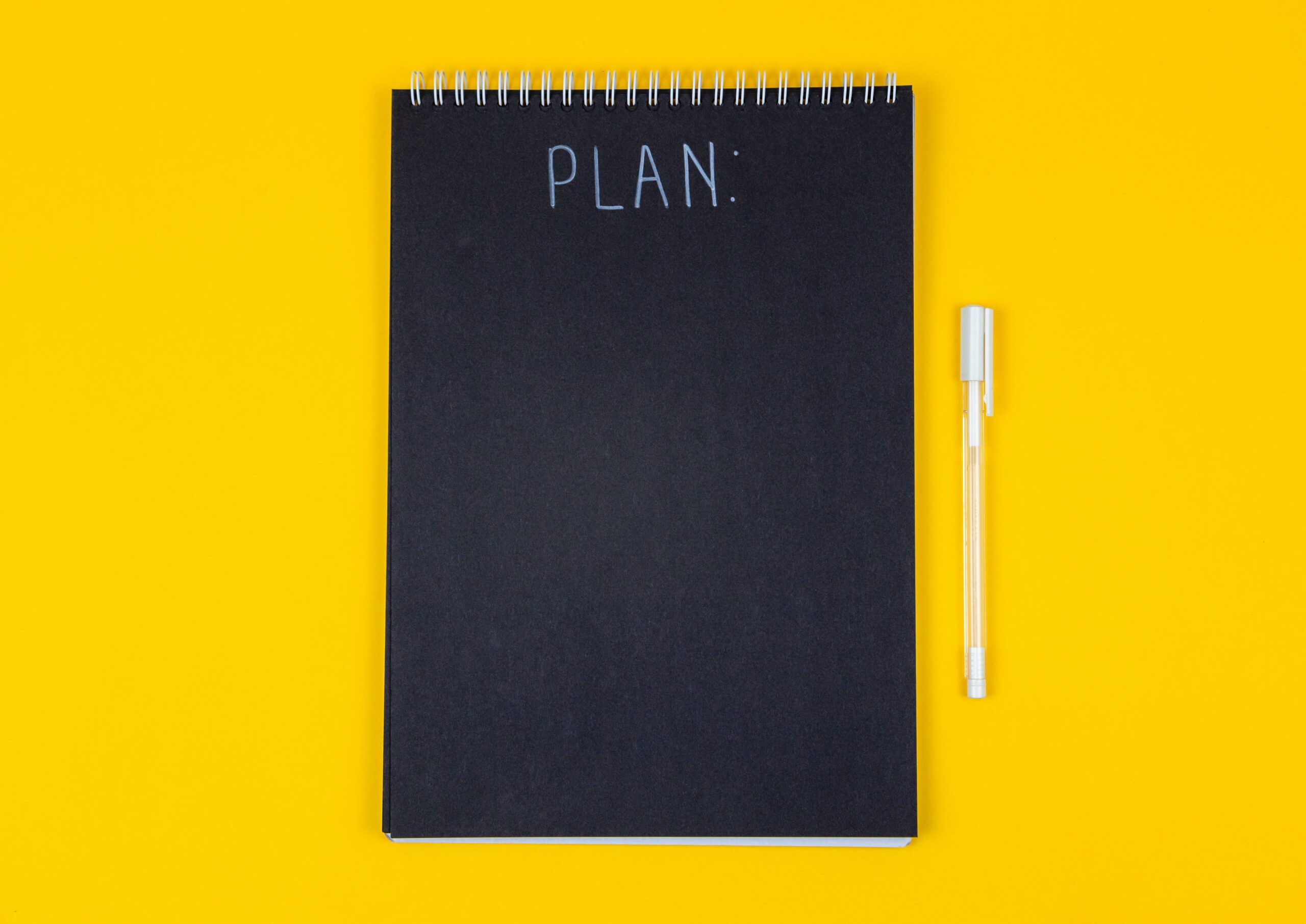 Flip-book binder with the word PLAN